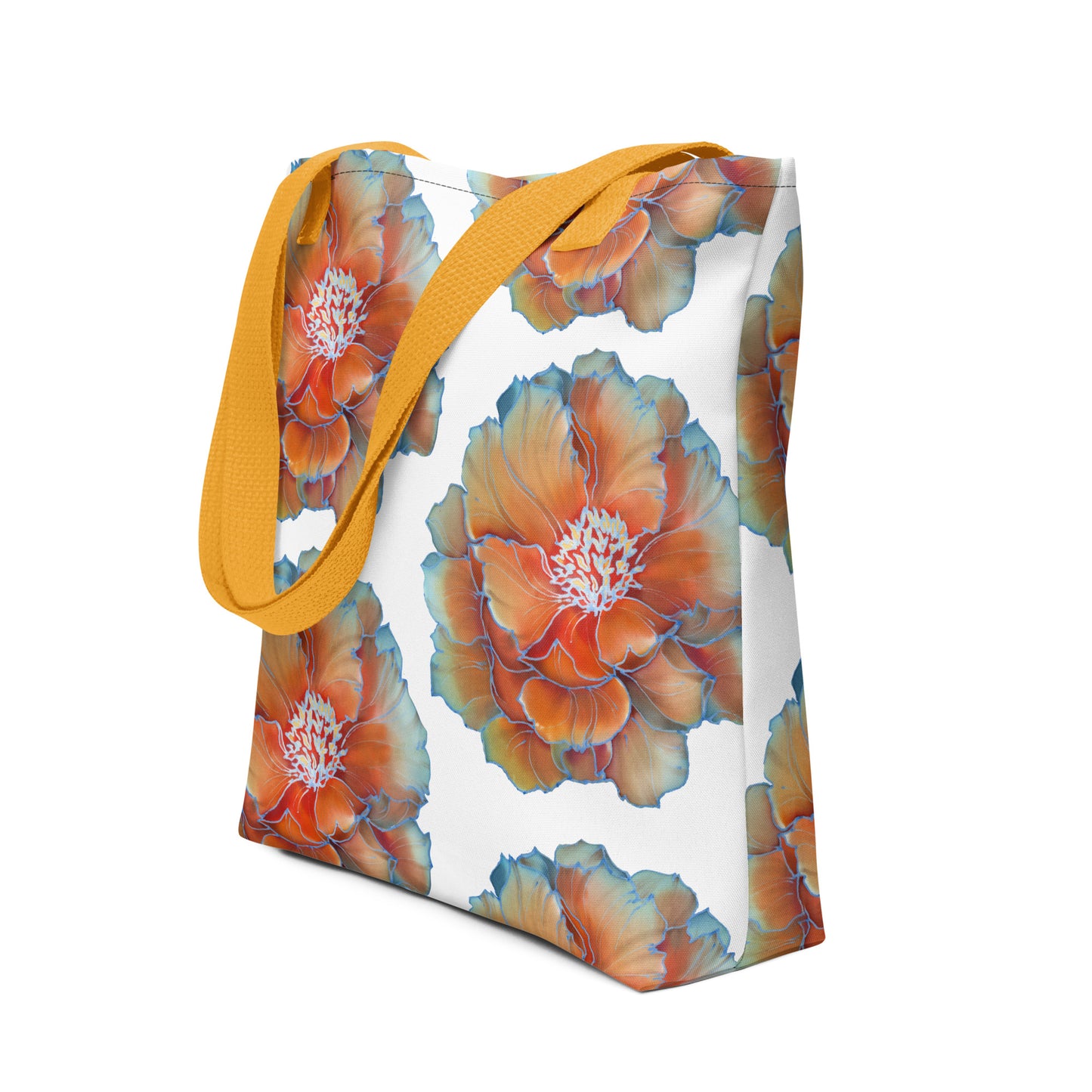 Stijlvolle 15x15 inch draagtas met all-over print van grote bloemen in oranje, goud en wit, afgewerkt met blauwe bloemblad randjes en een gele handvatten. zij uitzicht handvat zwart
